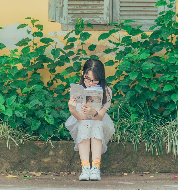 Girl sat reading a book