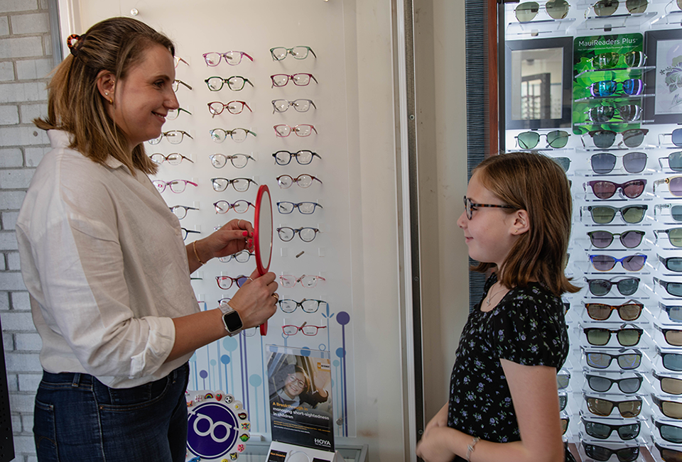 Mum and child picking glasses