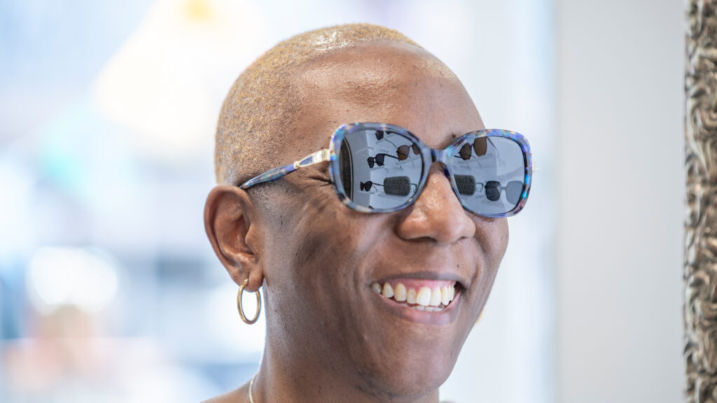 Woman trying on sunglasses