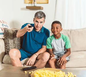 two people watching TV