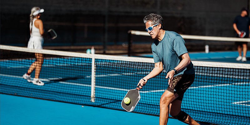 Someone playing Pickleball